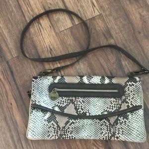 Jessica Simpson over shoulder or clutch purse